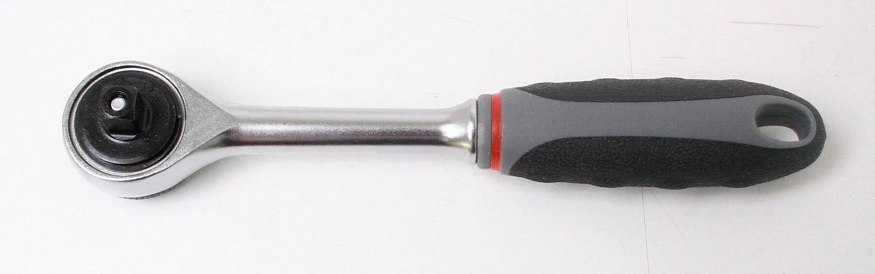 Reversible 1/4" ratchet showing square drive, chrome shaft and grey/black ergonomic ASTA handle with red ring and hanging hole