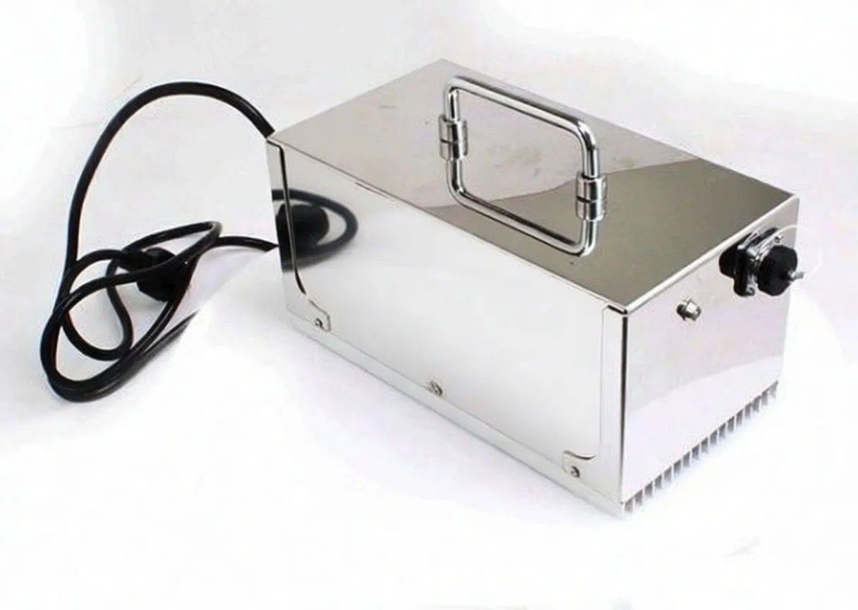 Stainless-steel rectangular induction heater with top handle, front control knob, vents and power cord.