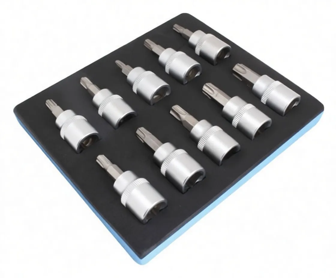 Line of ten chrome 3/8" drive Torx socket bits arranged on a white background, knurled bodies and star-shaped tips visible