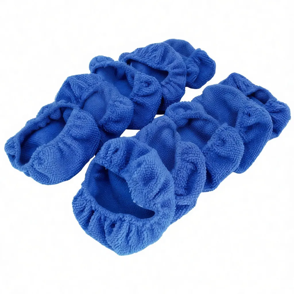 Close-up of blue microfiber covers showing elastic opening, interior seam and pile texture