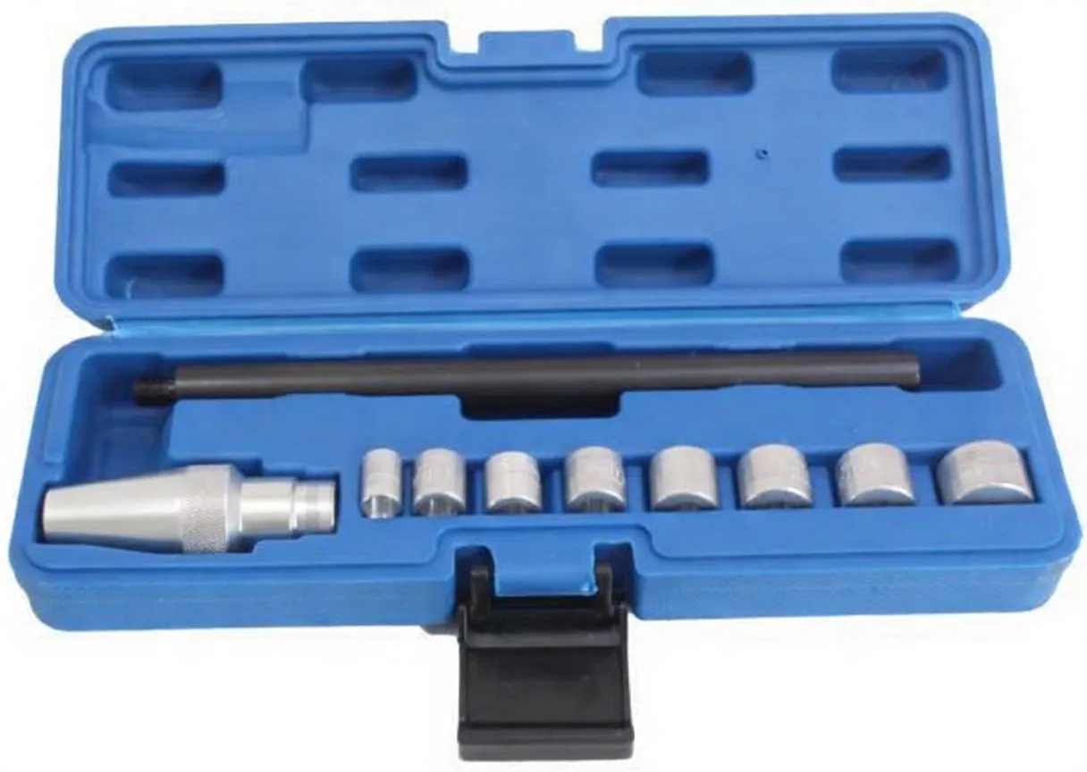 Front view of open blue tool case showing long black shaft with white text, a knurled silver alignment cone and a row of eight silver bushing adapters; black latch on front.