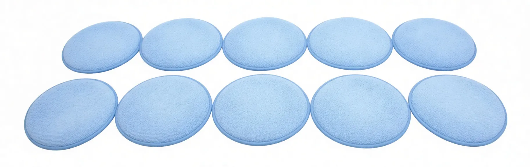 Two rows of ten blue round sponge pads; top row shows labeled stitched faces with 'saTra' tags, bottom row shows plain reverse faces.