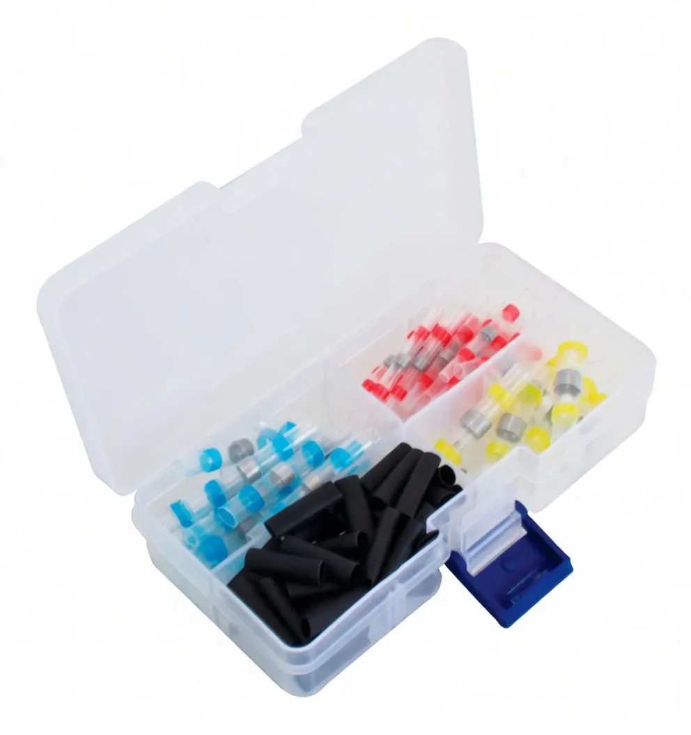 Angled view of organizer box with color‑coded shrink solder sleeves (red, yellow, blue) and black heat‑shrink tubing in separate compartments