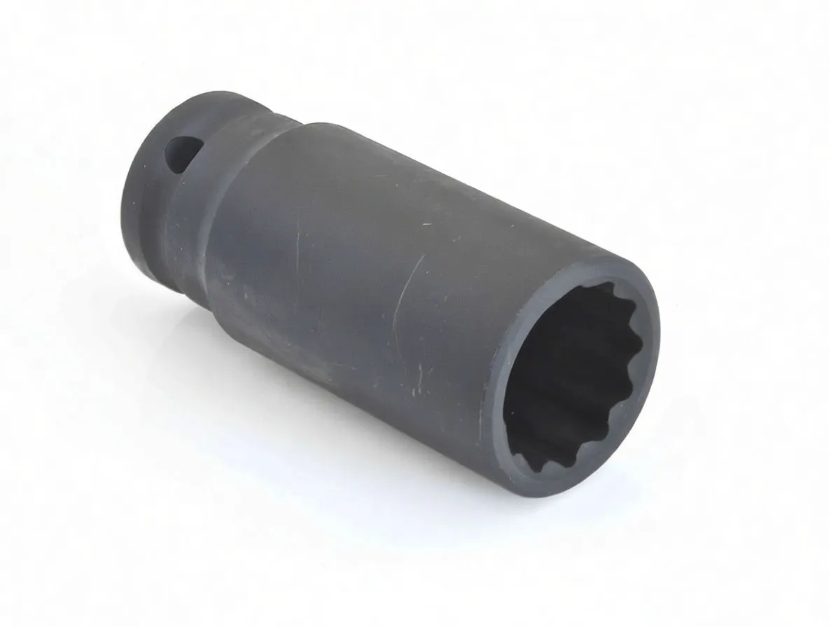 Angled view of a long black 12-point impact socket lying on its side, showing internal profile and drive detent hole; marked ASTA CR-MO 23mm.