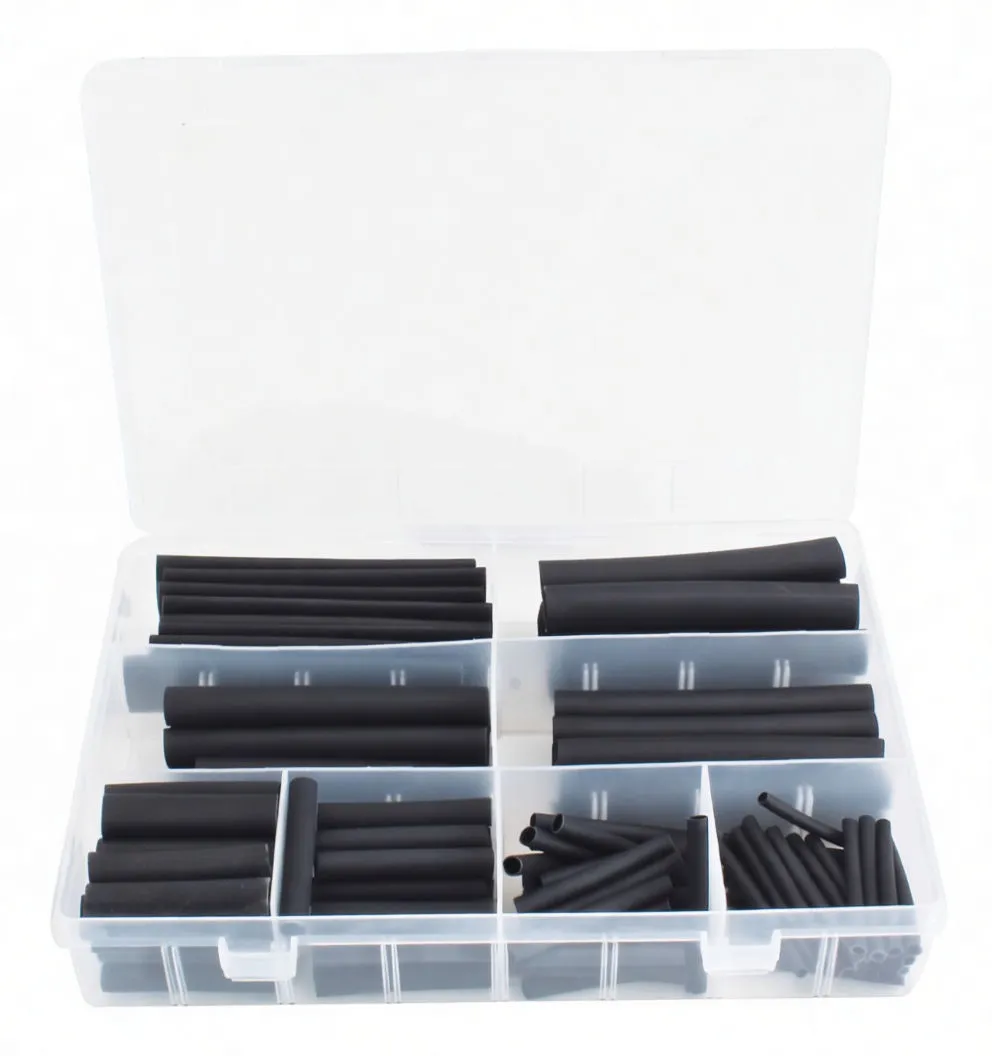 Overhead view of clear organizer box with assorted black heat shrink tubing sorted into compartments