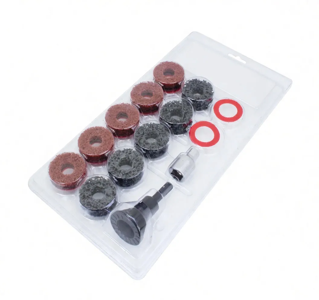 Blister-packaged 14-piece hub and piston cleaning set with abrasive donuts, red rings, black mandrel and silver socket visible under clear plastic