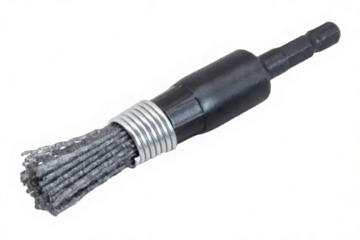 Side view of a drill-mounted brush with silver coil and clustered grey silicone-nylon filaments