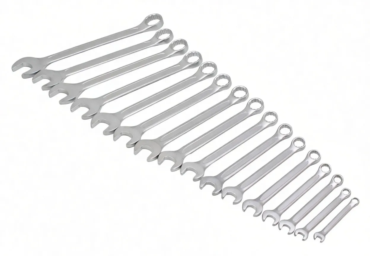 Sixteen chrome combination spanners arranged in a row showing open and ring ends