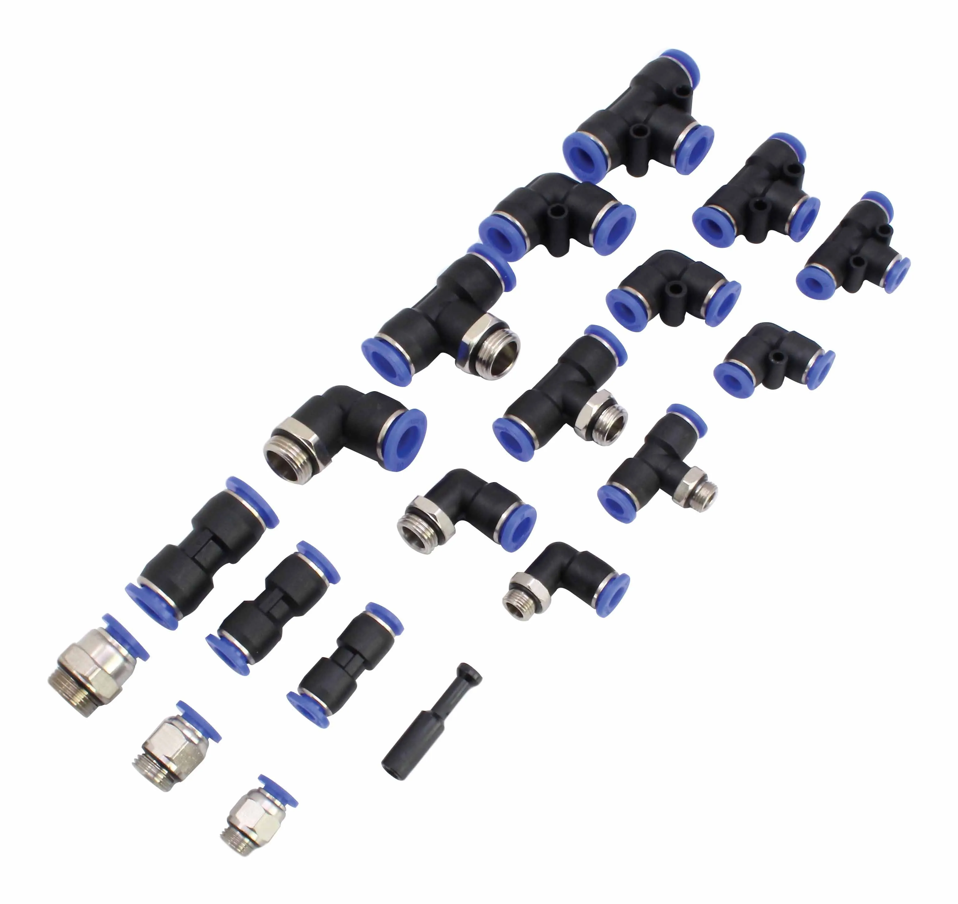 Assorted push-fit pneumatic connectors and threaded adapters arranged on white