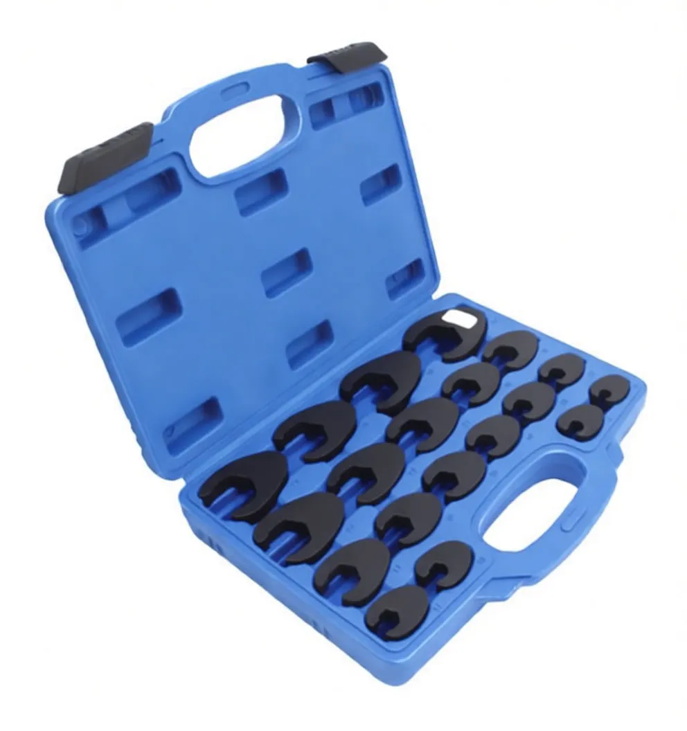 Top-down close-up of crowfoot wrenches in a blue case showing size and material markings on each tool.