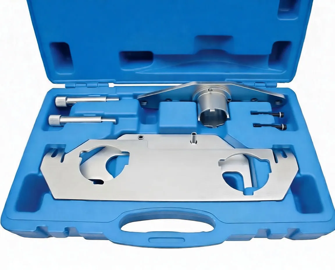 Frontal top-down view of timing tool kit with large locking plate, splined adapter, alignment pins and black fasteners in blue case