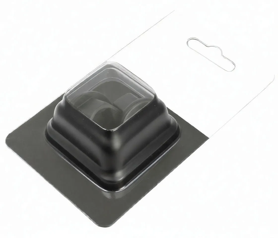 Close-up of two different-profile plastic drain plug tools, four-lobed and three-tab designs