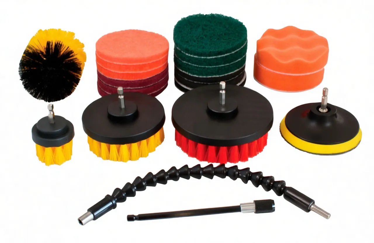 Three round bristle brush heads, cylindrical scrub brush, stacks of scouring and foam pads, backing pad and two drill adapter extensions on white background.