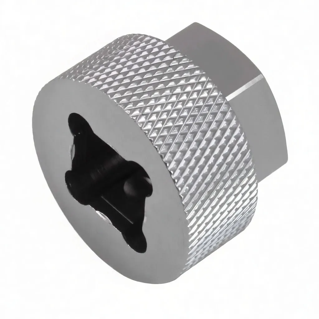 Underside view of silver tool showing internal lobed recess, knurled grip, and ASTA logo