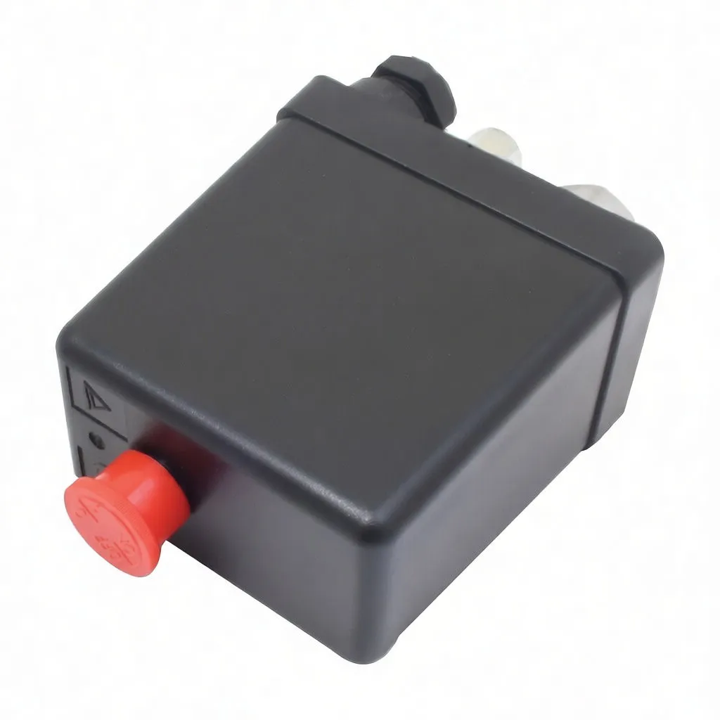 Rear/top view of black pressure switch showing red reset button, warning symbol and embossed marking