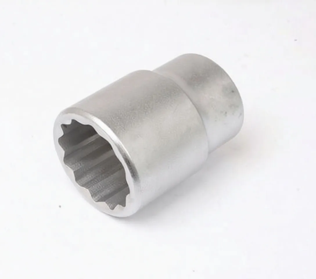 Socket viewed from the 12-point end showing internal 12-point profile and detent hole on the drive end.