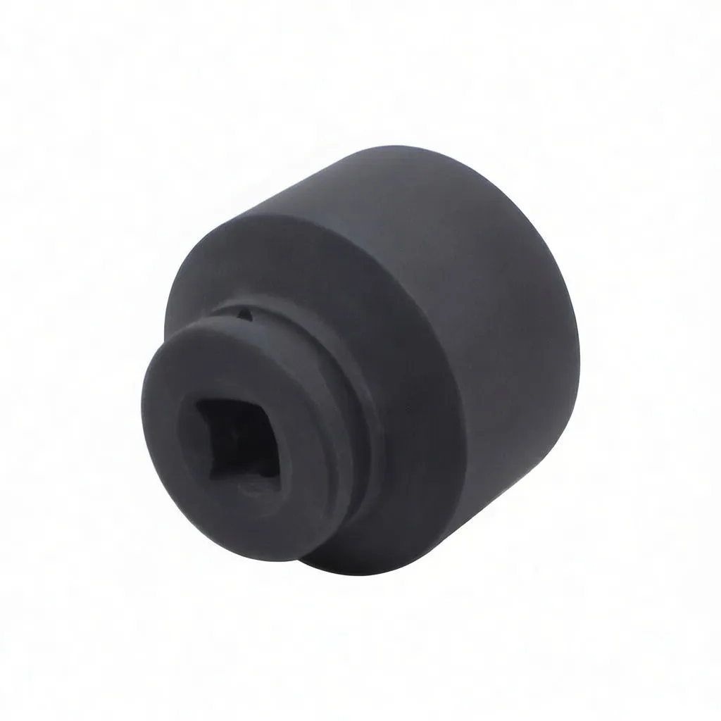 Angled view of the socket’s drive end showing square drive recess, detent groove, and black impact finish with partial branding.