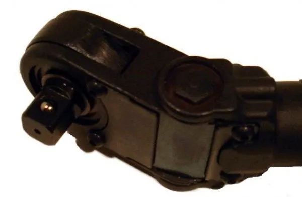 Close-up of black ratchet head and 3/8 inch square drive with detent ball
