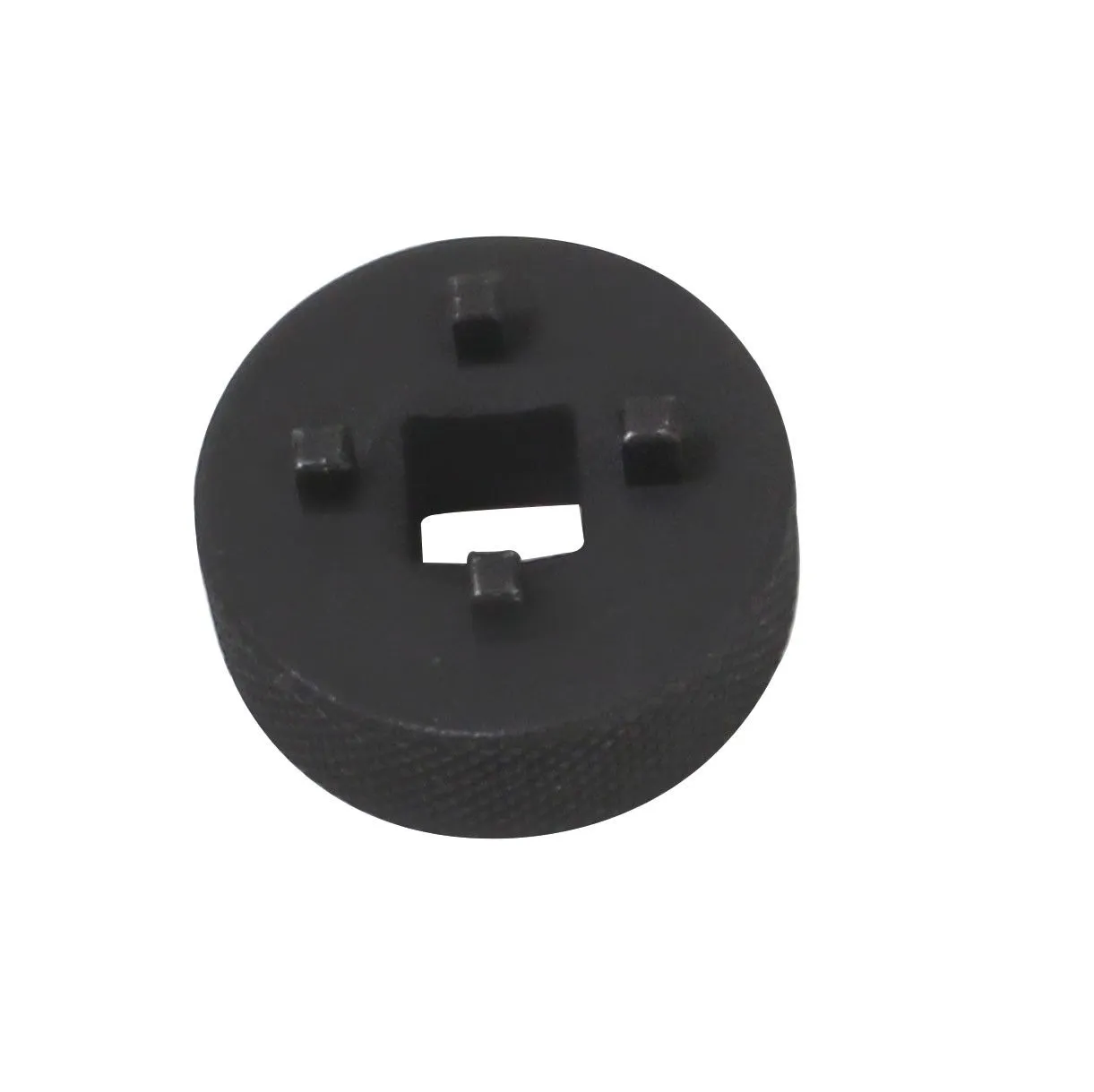 Top view of round black pump key showing four tabs around a central square socket and knurled rim.