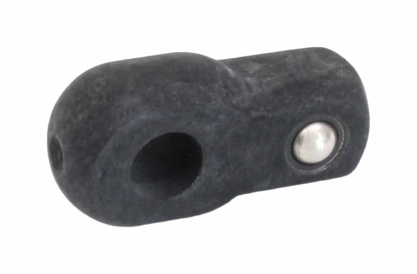 Close-up of dark molded eyelet with large hole and metal ball detent