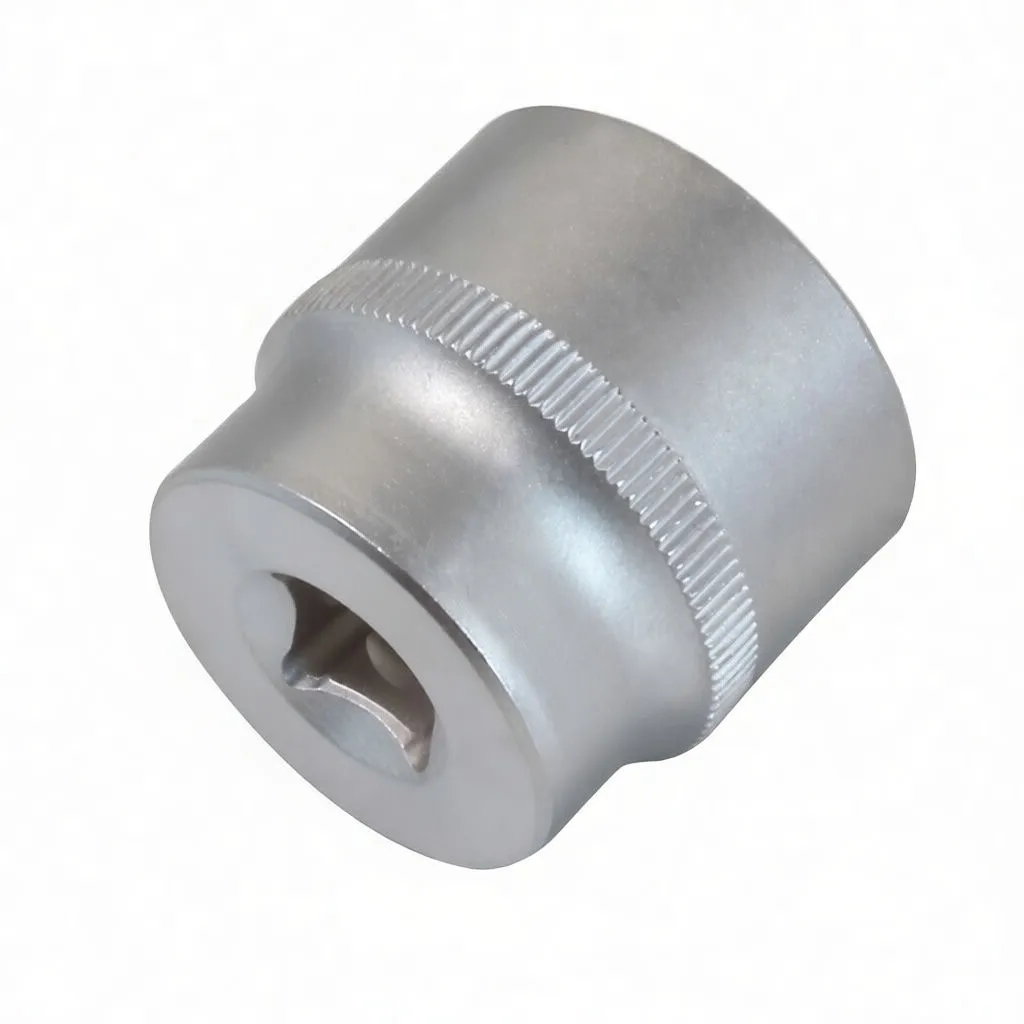 Top view into a short 6-point chrome socket showing internal hex profile and knurled band