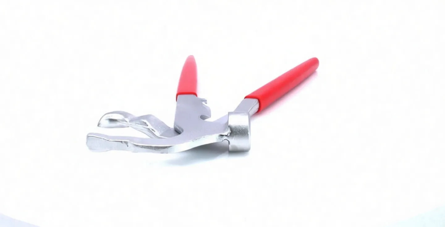 Close-up of wheel-weight pliers showing hooked jaws, hammer face, pivot rivet and red handles
