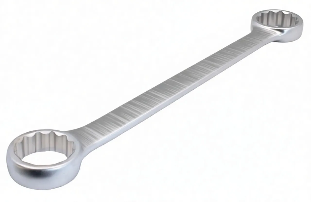 Close-up of open-end jaw of matte finish combination wrench with box-end visible in background