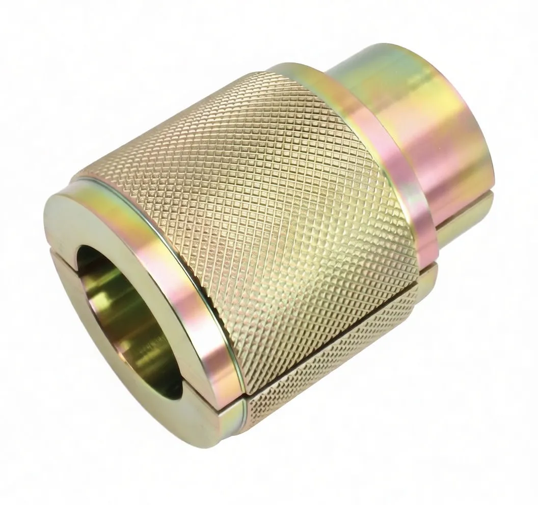 Top three‑quarter view of knurled, gold‑plated two‑half cylindrical fork seal driver with visible seam and stamped marking