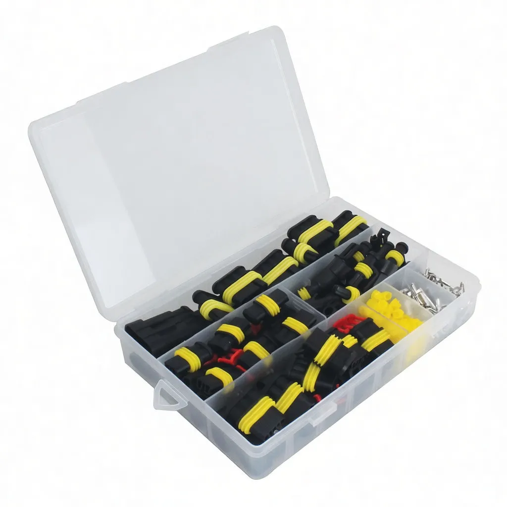 Angled open case showing organized black multi‑pin connector housings with yellow seals, red locking inserts and silver crimp terminals