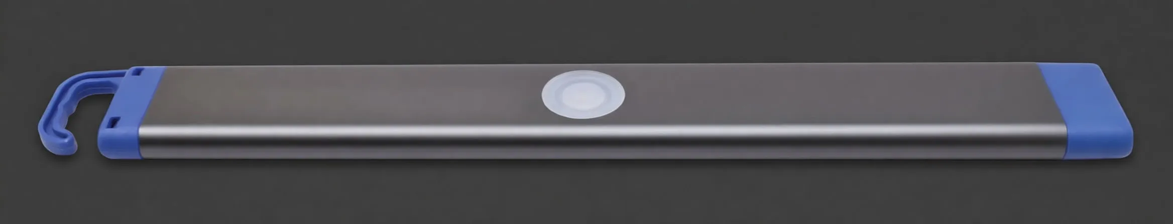 Side profile showing thin 10.5mm slim work light with finger for scale