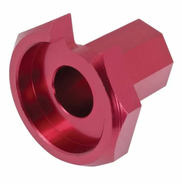 Underside view of red anodized tool showing stepped inner recess and central bore, machined flats on the body