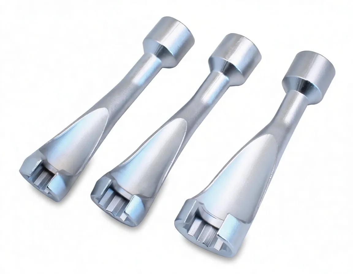 Close-up of three silver injection line wrenches showing cylindrical socket collars with holes and multi-slot heads