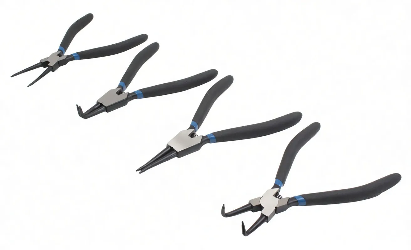 Four circlip pliers with different jaw shapes arranged on a white surface, showing straight and angled tips and black handles.
