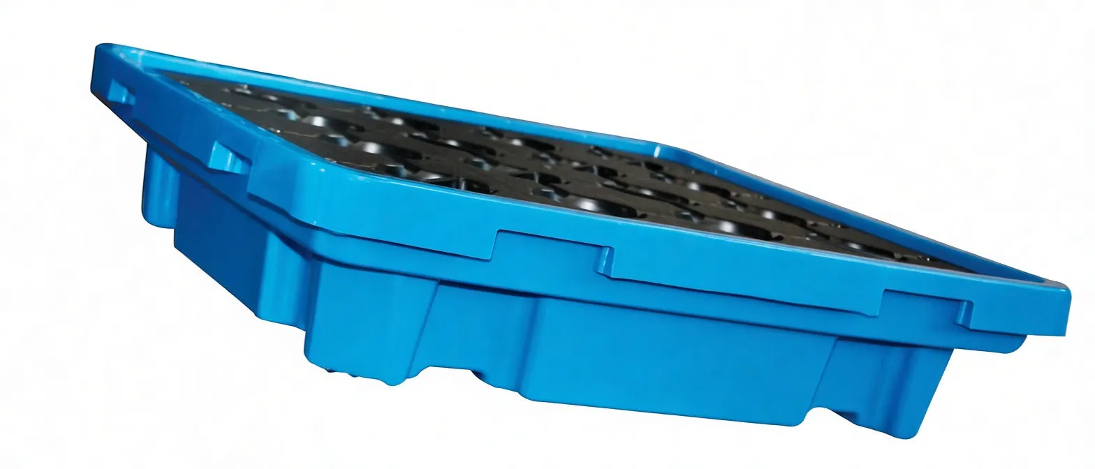 Side angle of blue drip tray highlighting side drain plug, reinforced molded walls and recessed grid area with side label.