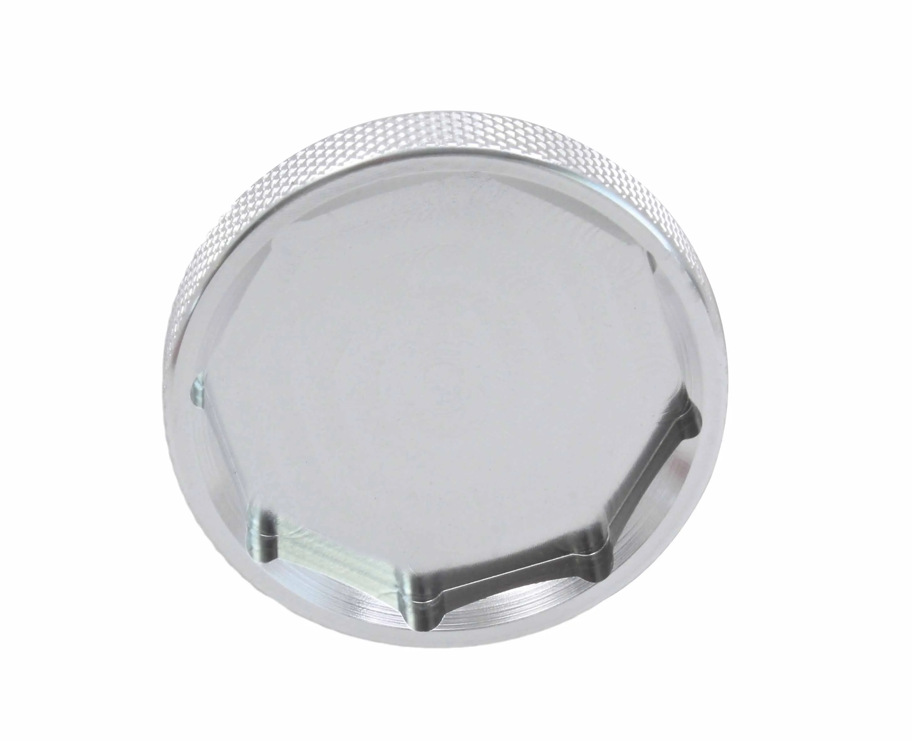 Bottom view of silver removal tool showing recessed six-flat engagement profile and knurled outer edge.