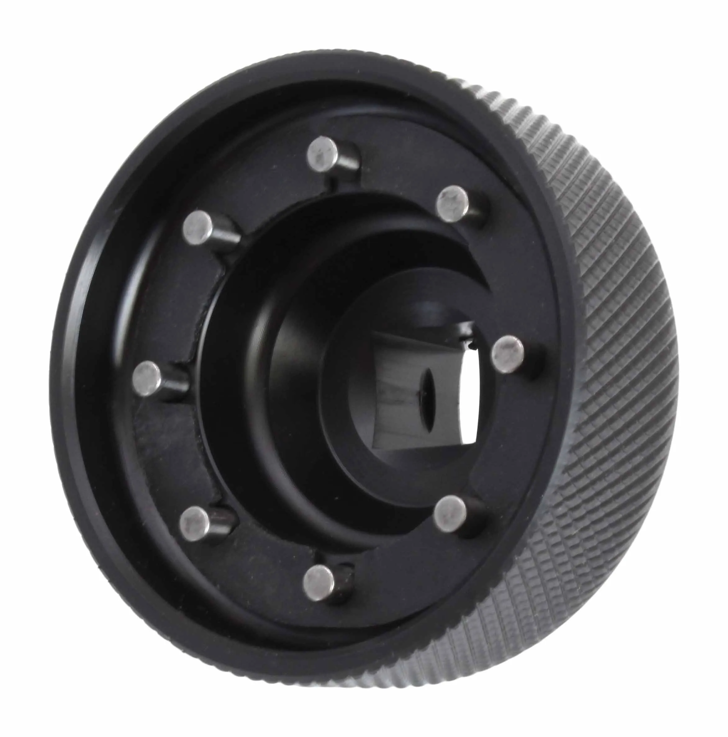 Angled close-up of the interior of a black fork cap socket showing eight steel pins and a central square drive with a small detent hole.