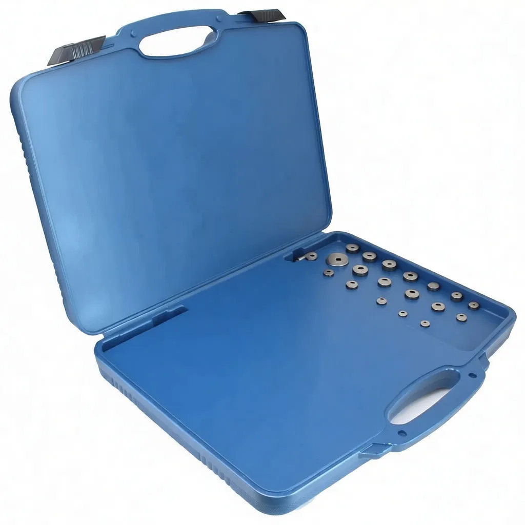 Angled open blue case with many round adapter plates, threaded wind-back tools, U-plates and socket adapters for caliper pistons.