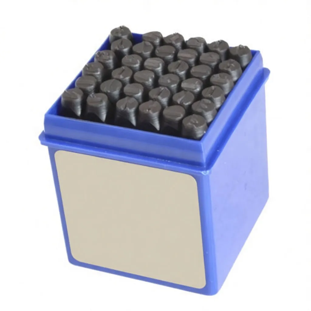 Angled view of blue box filled with black metal punches, label showing brand saTra and 36 pcs, characters visible on punch ends