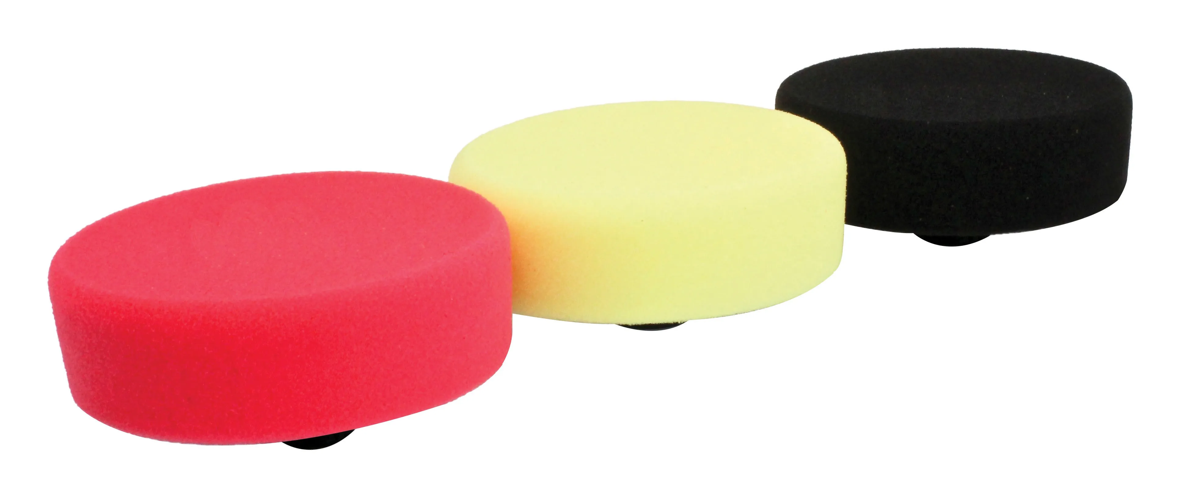 Side profile of three round foam polishing pads showing smooth colored tops and pad height