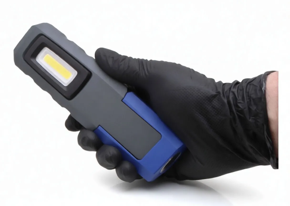 Front view of COB work light with ASTA logo and USB charging cable