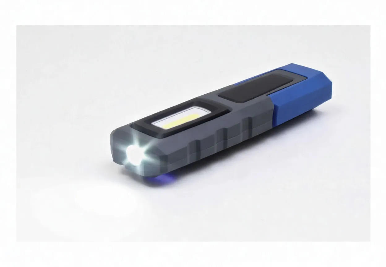 Work light showing two forward spot LEDs illuminated and textured grip