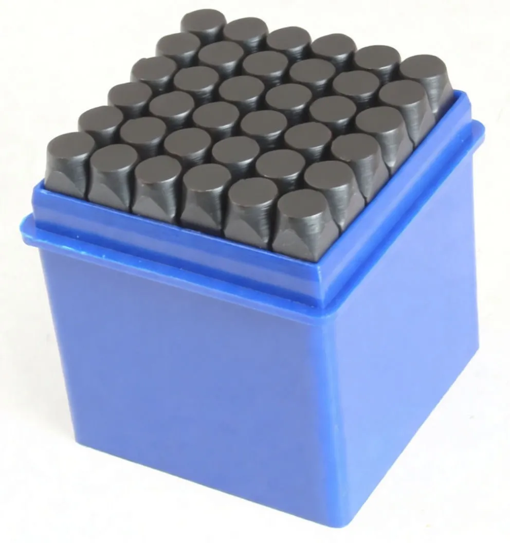 Close-up angled view of blue box filled with black character punches, front label showing product details and barcode