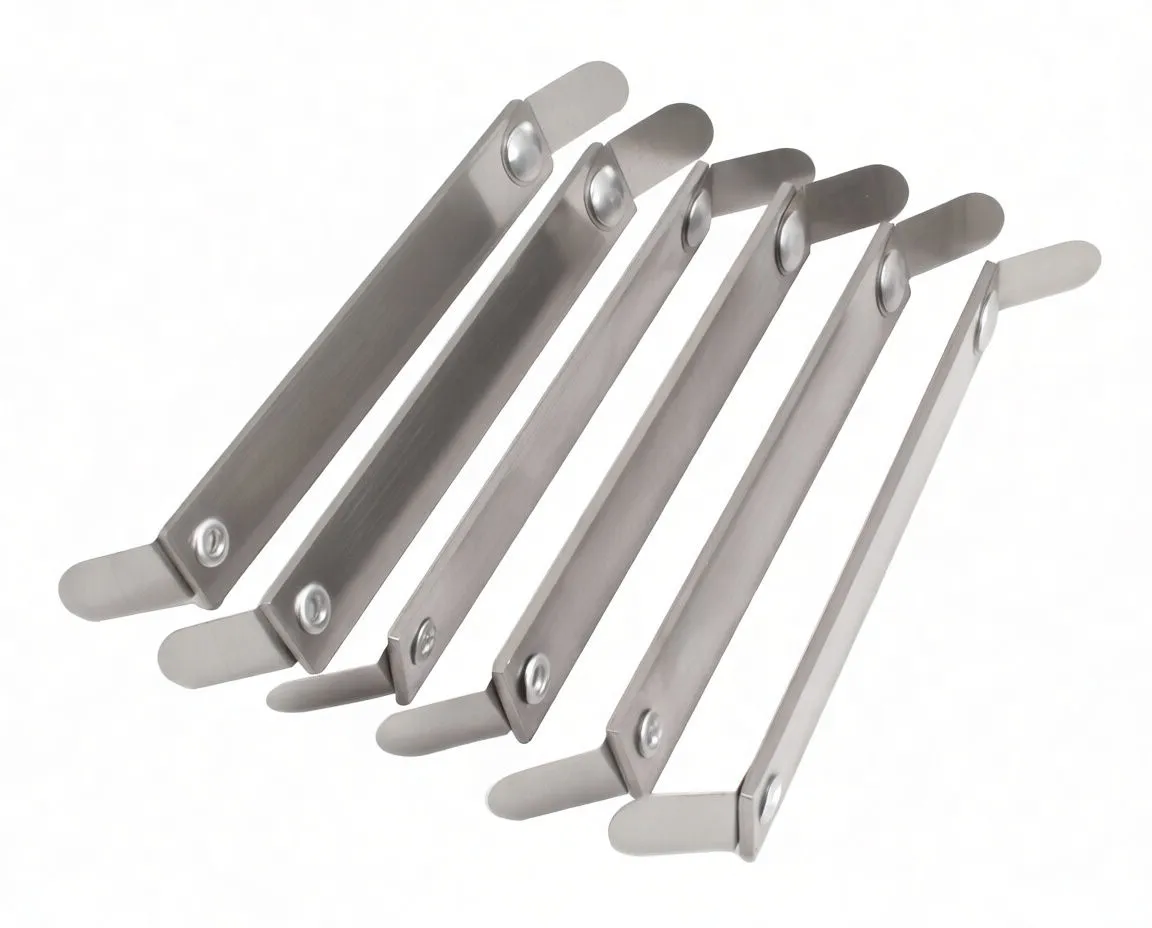 Six flat metal feeler gauge blades laid out, showing pivot rivets and stamped thickness markings