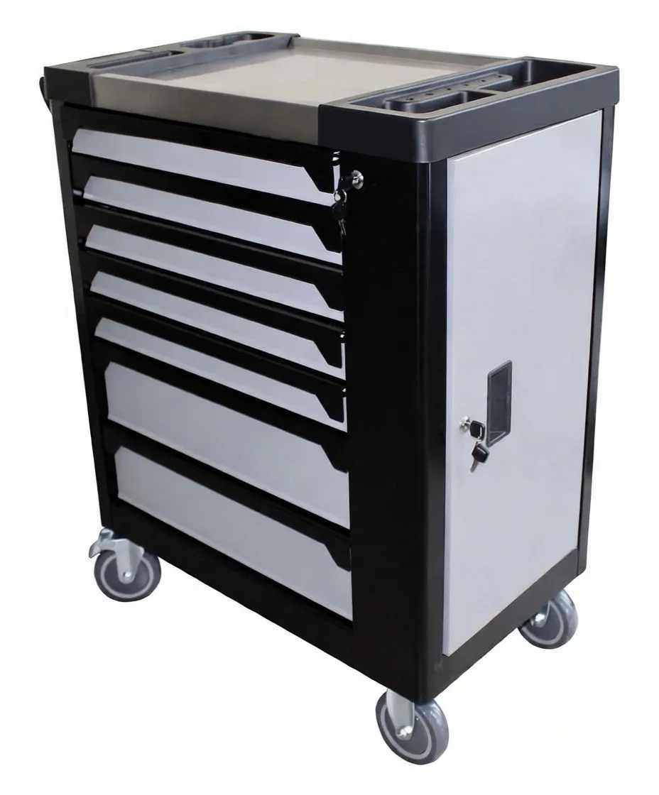 Detail of open drawers with foam organizers and gloved hand removing a wrench