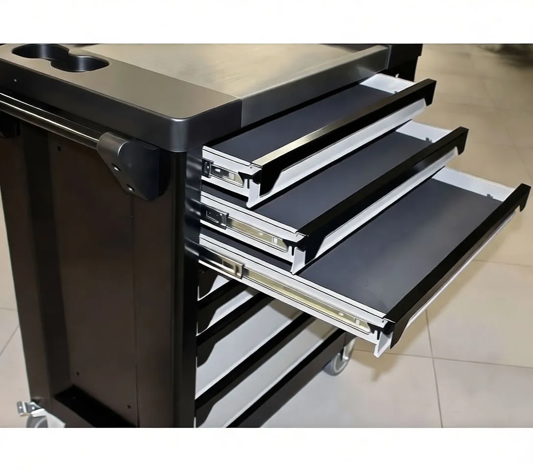 Top drawers of tool cabinet with foam trays full of sockets and a hand picking up a socket