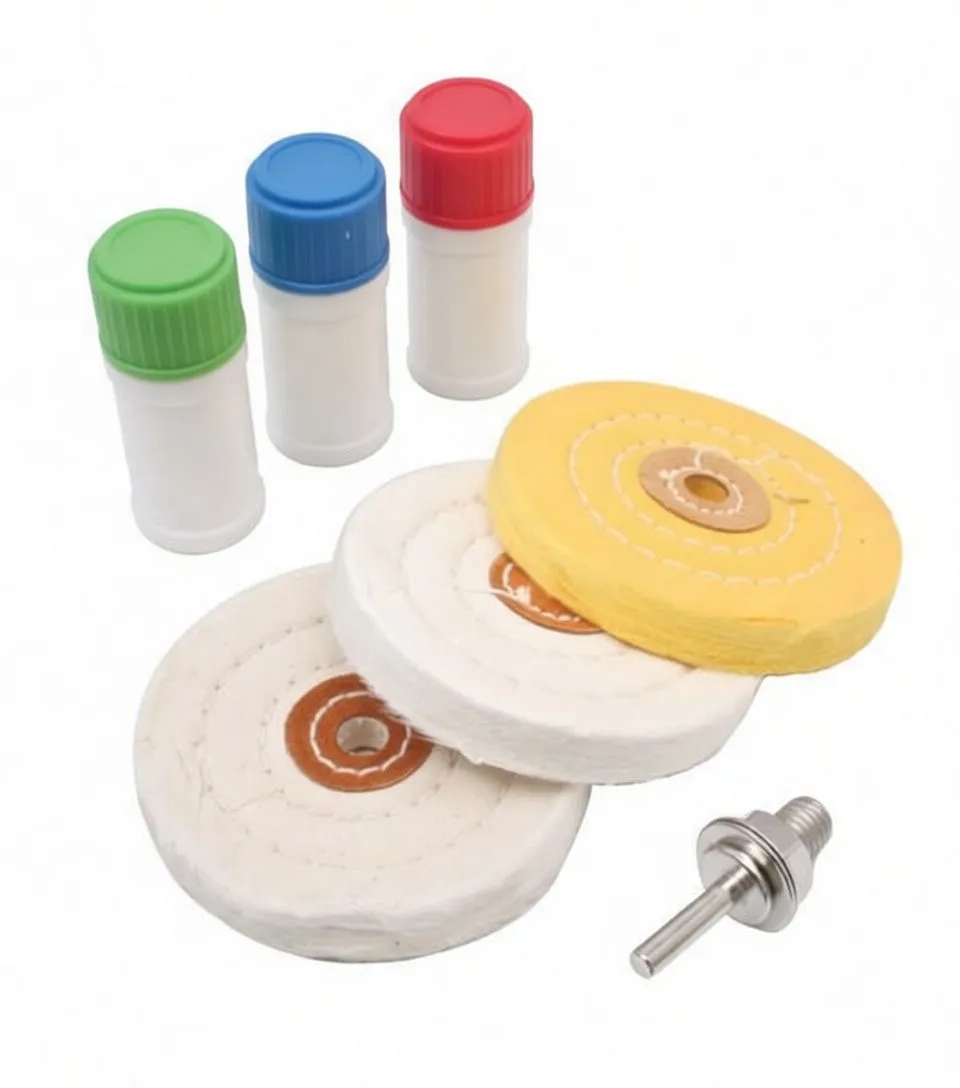 Angled view of three buffing wheels, three SaTra polish bottles with colored caps, and a mandrel