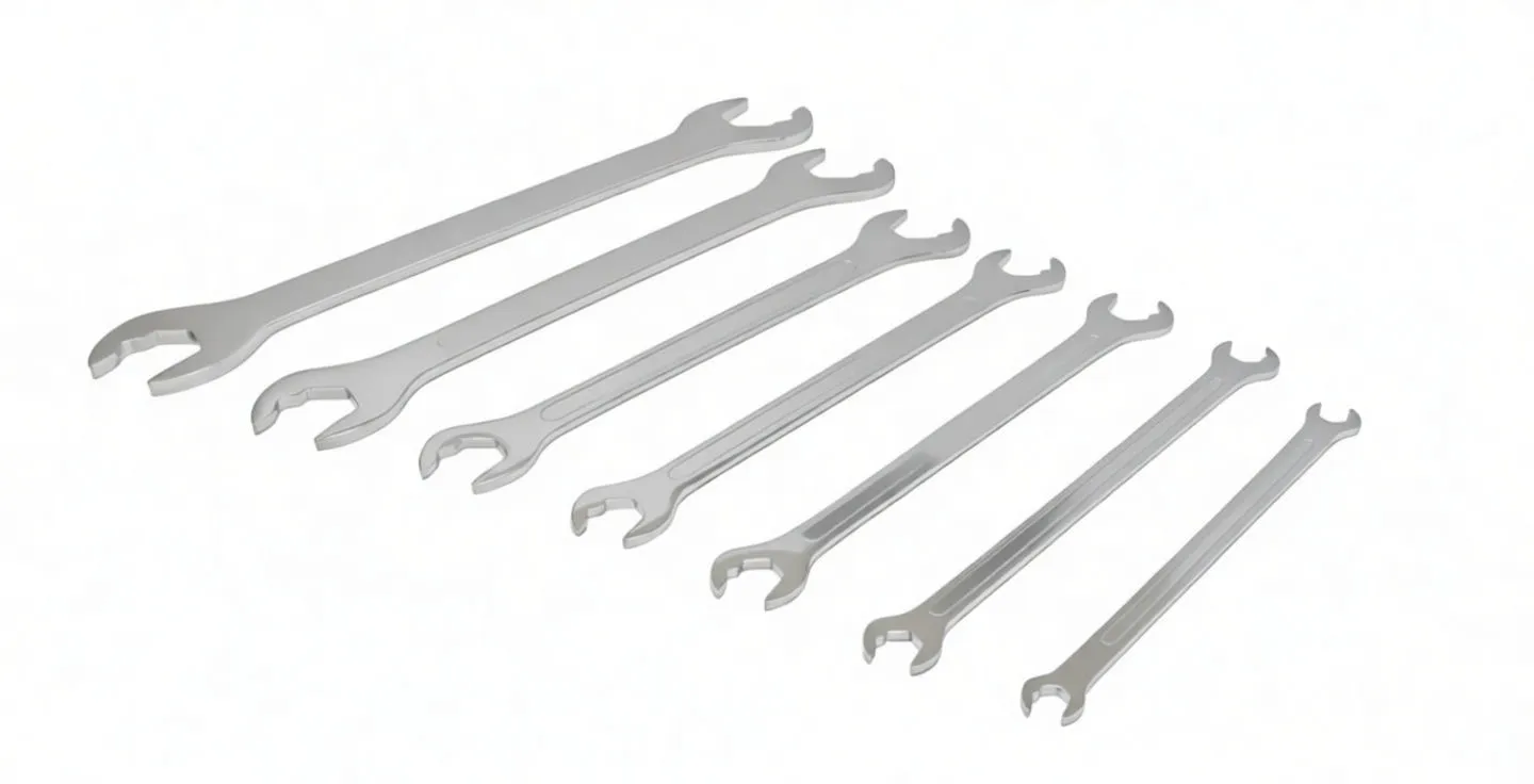 Seven chrome super-thin ratcheting spanners arranged on white background, visible stamped size markings