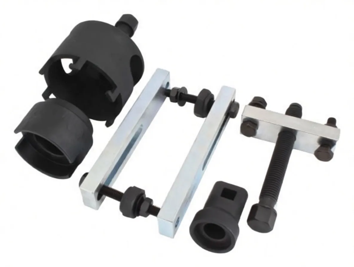 Individual puller components laid out: two black extractor cups, square adapter, silver yoke arms, T-bar forcing screw and bolts on white background
