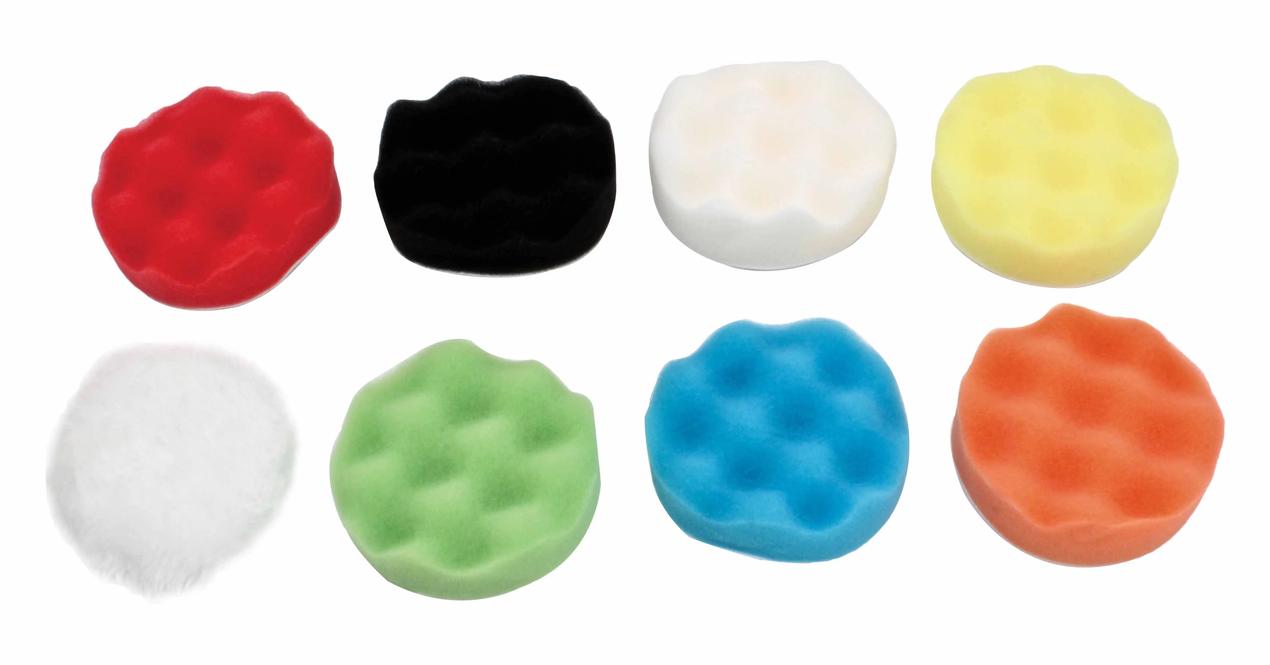 Top view of eight round polishing pads in different colors including a white fluffy pad