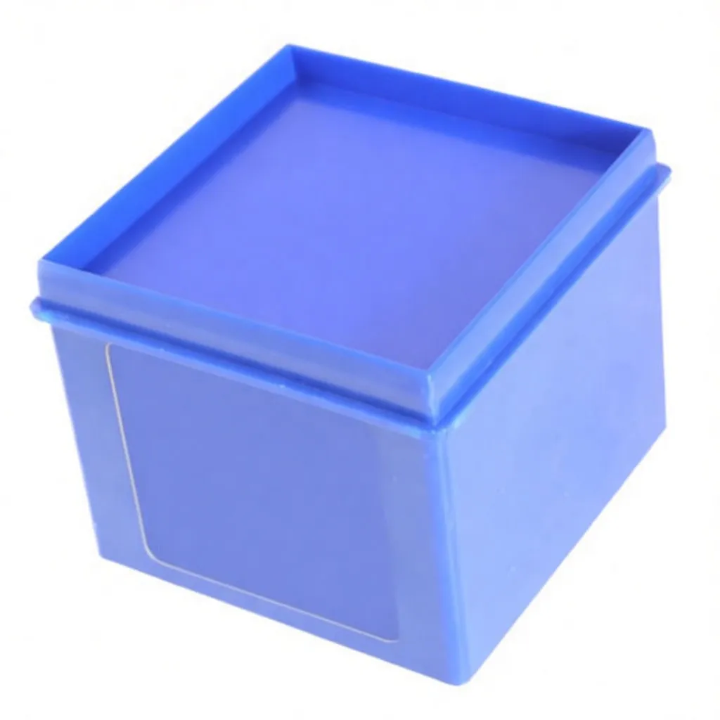 Angled close-up of a blue box of 36 metal alphanumeric punches, label reading 'saTra 36' visible